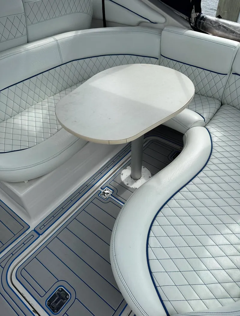 Slide: The Image of Luxurious seating area on a 2002 Four Winns 268 Vista boat with quilted upholstery. - 11