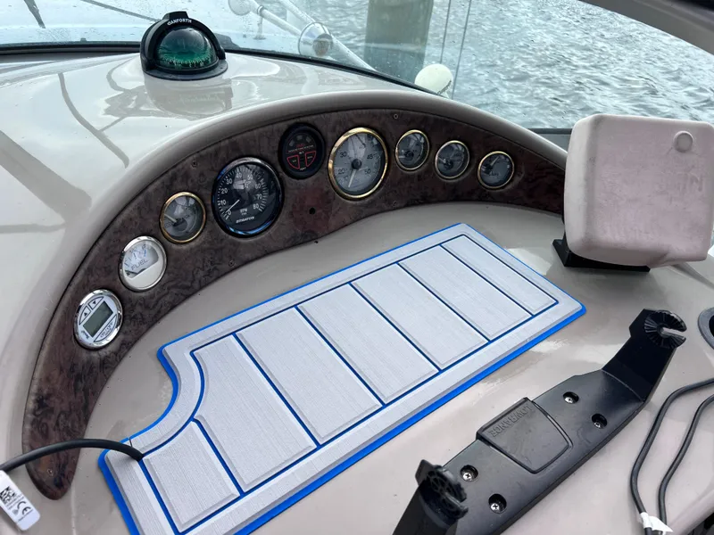 Slide: The Image of Dashboard of 2002 Four Winns 268 Vista boat with gauges and compass. - 16