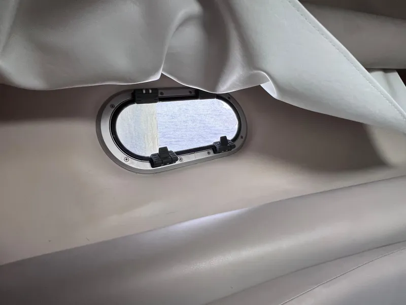 Slide: The Image of Interior view of a 2002 Four Winns 268 Vista boat window with curtain. - 26