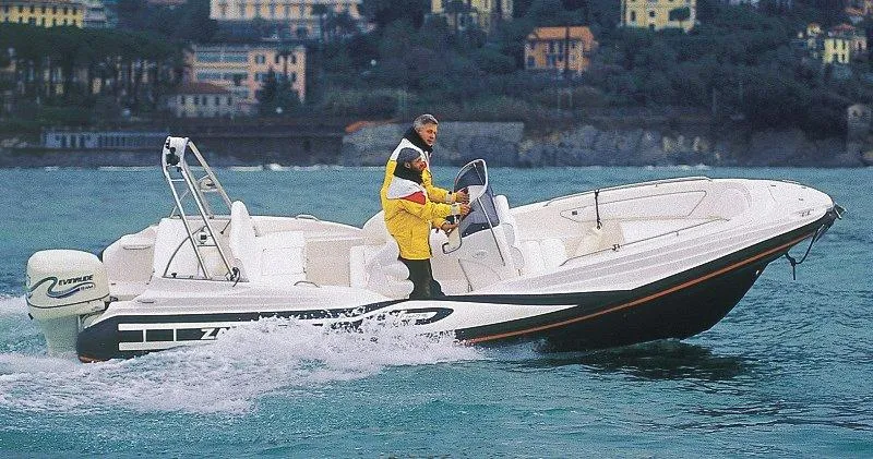 Slide: The Image of 2025 Zar Formenti 65 Suite boat cruising on water with two passengers. - 12