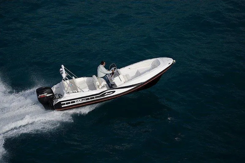 Slide: The Image of Zar Formenti 65 Suite 2025 boat cruising on open water. - 18