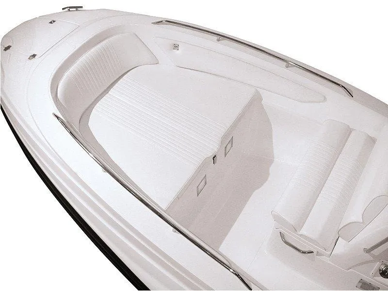 Slide: The Image of 2025 Zar Formenti 65 Suite boat interior, featuring sleek white seating and modern design. - 19