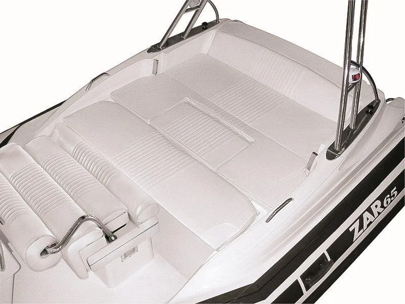 Slide: The Image of 2025 Zar Formenti 65 Suite boat interior with white cushioned seating and sleek design. - 20