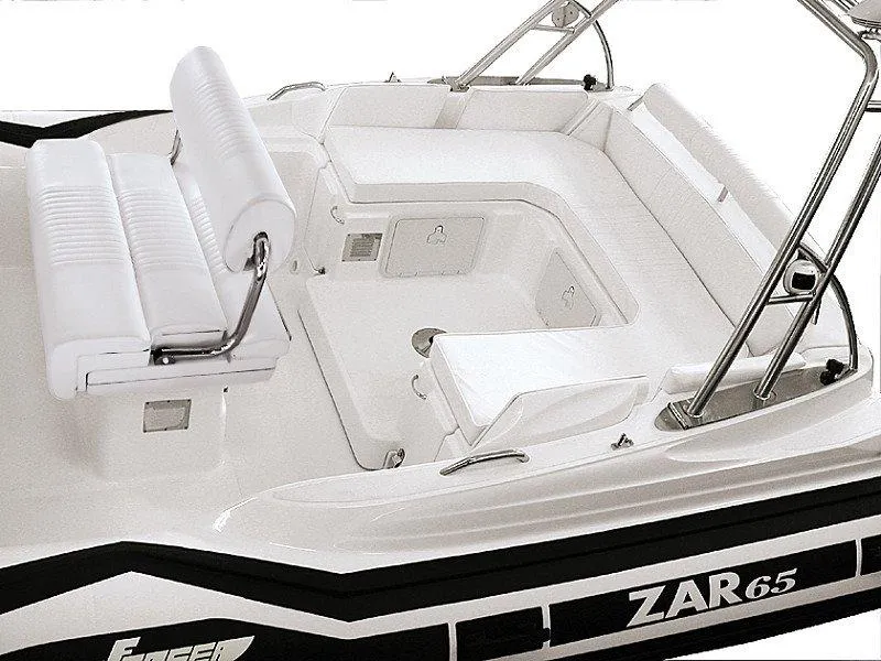 Slide: The Image of 2025 Zar Formenti 65 Suite boat interior with white seating and sleek design. - 22