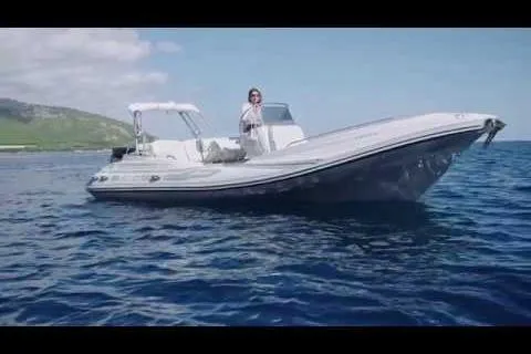 Slide: The Image of 2027 Zar Formenti 65 Suite boat on open water with scenic coastal backdrop. - 4