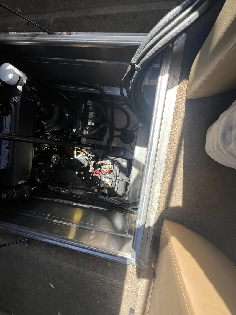 Slide: The Image of Engine compartment of a 2016 Bennington 2552 QCW I/O boat, showing internal components and wiring. - 13
