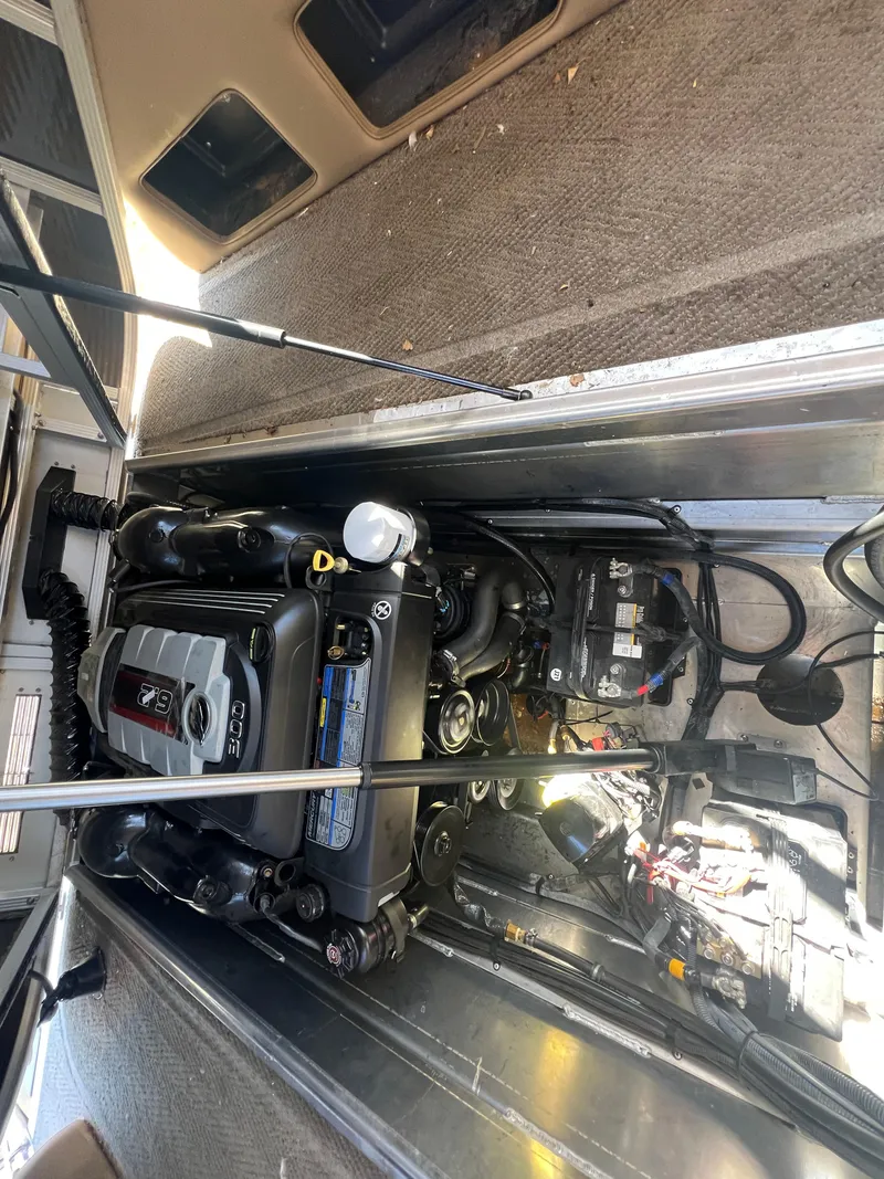 Slide: The Image of Engine compartment of a 2016 Bennington 2552 QCW I/O boat, showcasing internal components. - 14