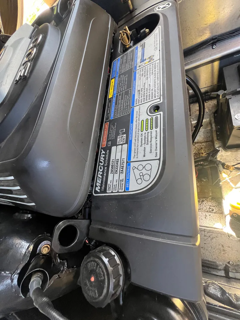 Slide: The Image of Engine compartment of a 2016 Bennington 2552 QCW I/O boat, featuring Mercury components. - 15