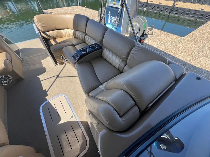 Slide: The Image of Luxurious seating on a 2016 Bennington 2552 QCW I/O pontoon boat, featuring plush leather upholstery. - 19