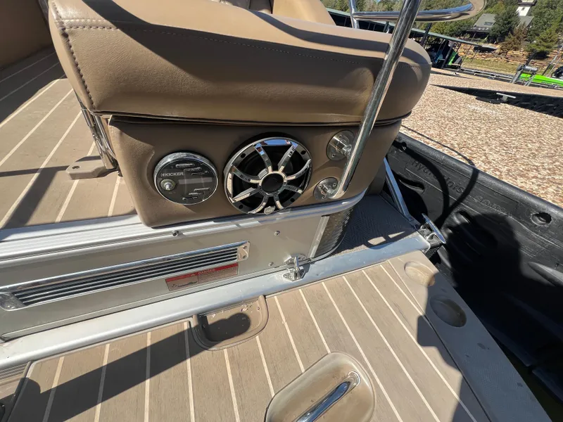 Slide: The Image of 2016 Bennington 2552 QCW I/O boat interior with speaker and control panel. - 20