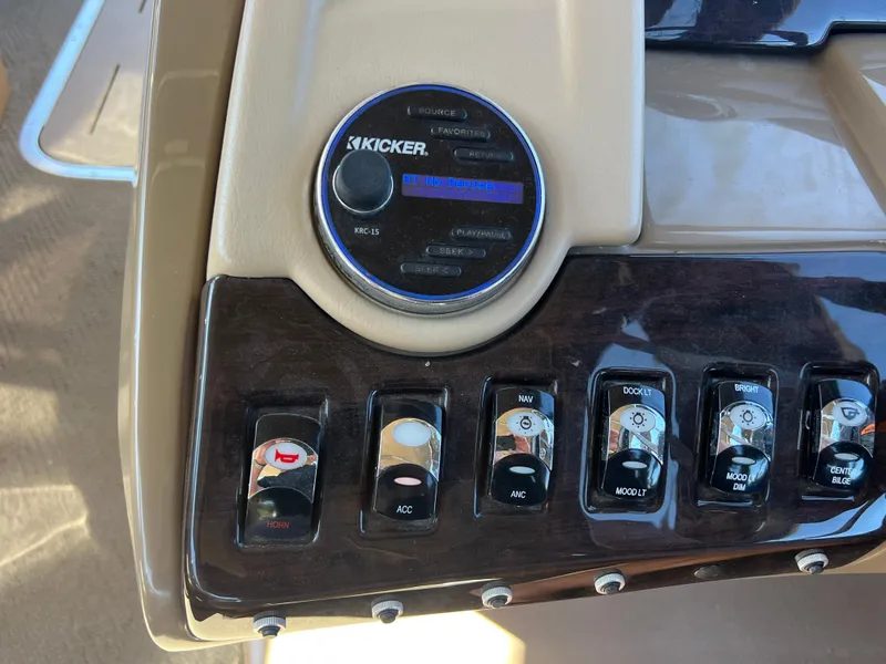 Slide: The Image of Control panel of a 2016 Bennington 2552 QCW I/O boat with Kicker audio system. - 25