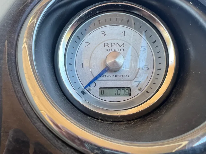 Slide: The Image of Tachometer of 2016 Bennington 2552 QCW I/O showing 1079 RPM. - 28