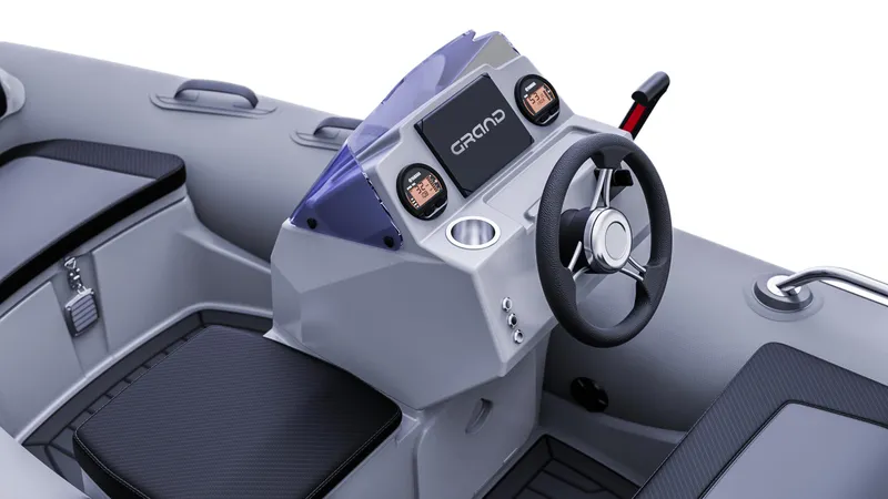Slide: The Image of 2025 Grand Inflatables G380 boat console with steering wheel and dashboard controls. - 13