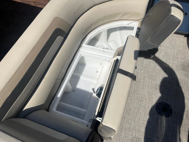 Slide: The Image of 2022 Viaggio Lago S boat with open storage compartment and beige seating. - 19