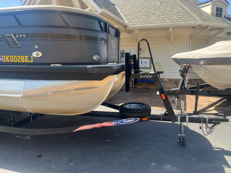 Slide: The Image of 2022 Viaggio Lago S boat on trailer, parked outside a house. - 3
