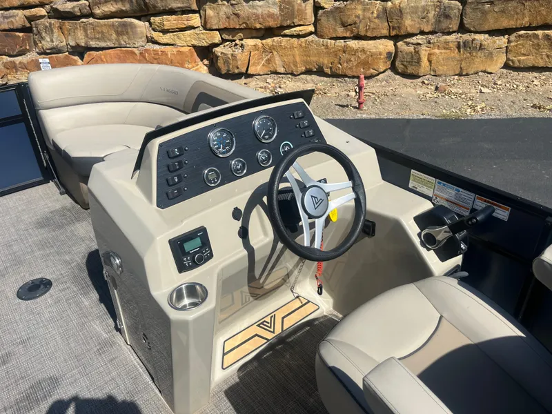 Slide: The Image of 2022 Viaggio Lago S boat interior with steering wheel and dashboard controls. - 31