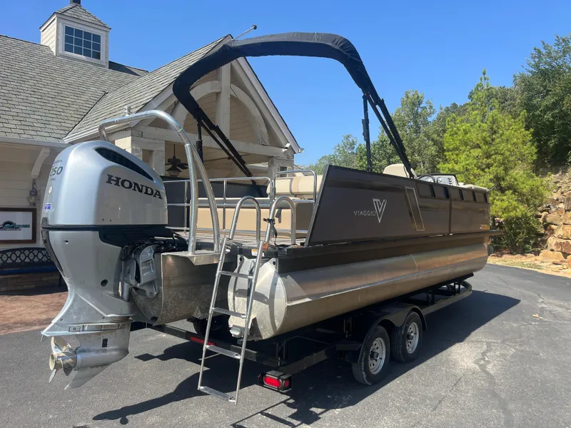 Slide: The Image of 2022 Viaggio Lago S pontoon boat on trailer with Honda outboard motor. - 4