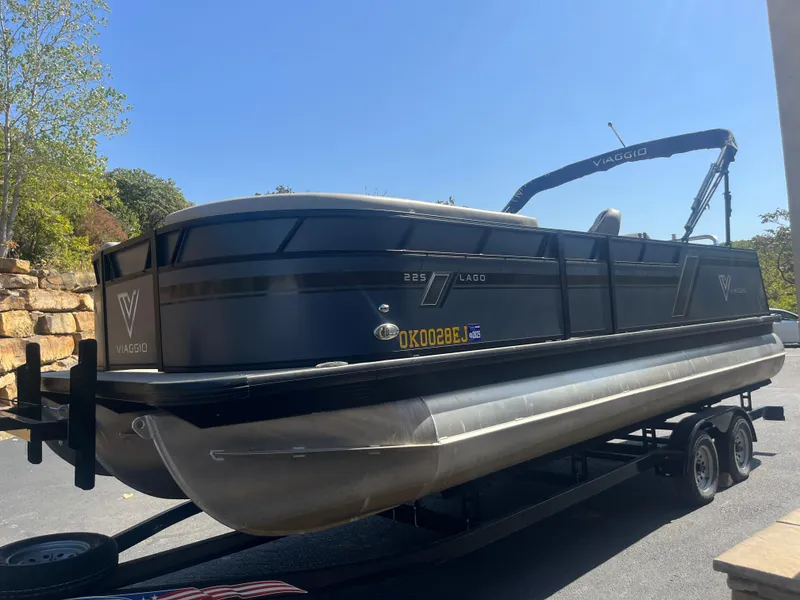 Slide: The Image of 2022 Viaggio Lago S pontoon boat on trailer, parked outdoors. - 5