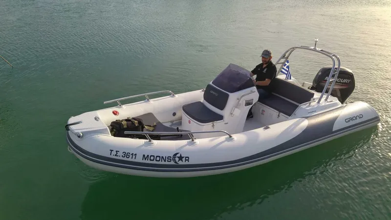 The Image of 2025 Grand Inflatables G500 boat on water, featuring sleek design and modern features. - 1