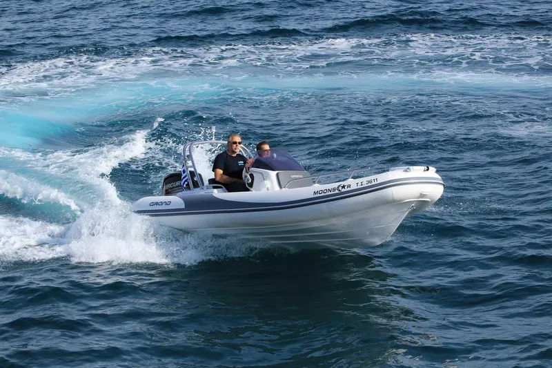 Slide: The Image of 2025 Grand Inflatables G500 boat cruising on open water. - 5