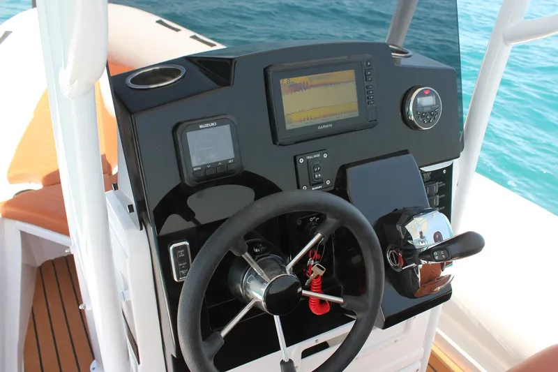 Slide: The Image of Cockpit of 2025 Tiger Marine 740 PL boat with modern navigation equipment. - 13