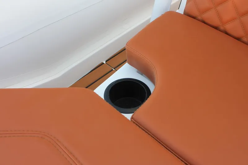 Slide: The Image of 2025 Tiger Marine 740 PL boat seat with cup holder, featuring brown leather upholstery. - 15