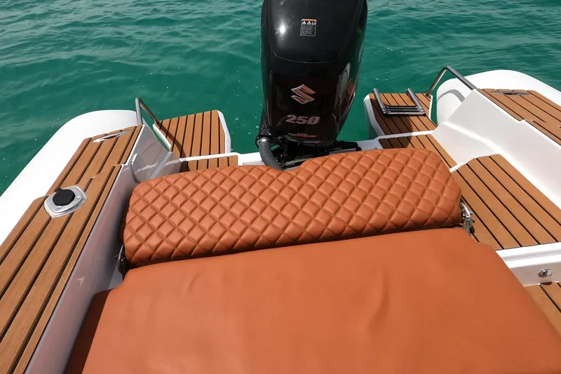 Slide: The Image of 2025 Tiger Marine 740 PL boat with Suzuki 250 engine, featuring luxurious brown seating and teak decking. - 21