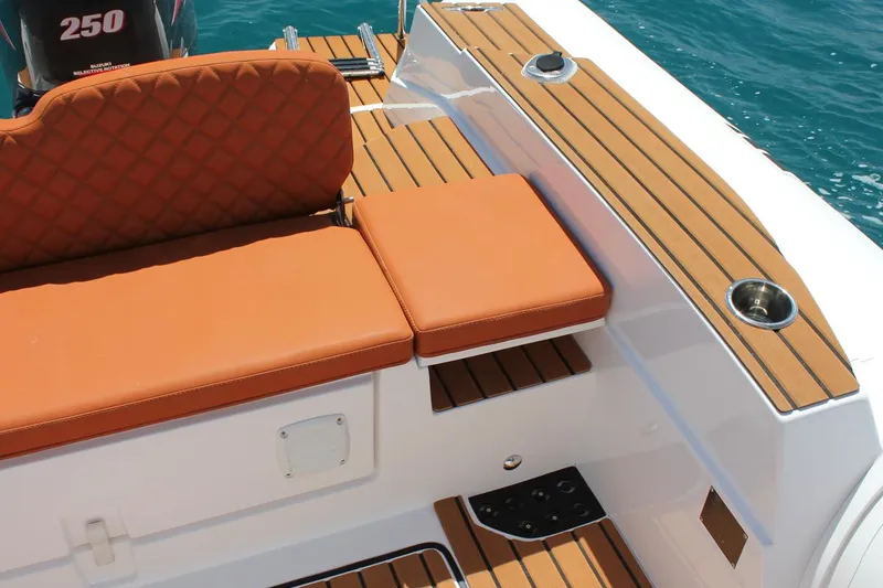 Slide: The Image of Luxurious seating on 2025 Tiger Marine 740 PL boat with teak accents. - 24