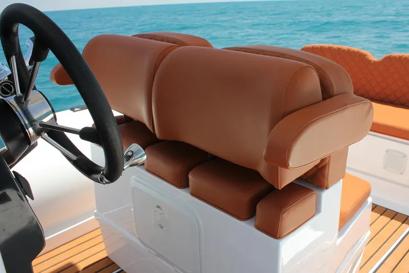 Slide: The Image of Luxurious seating on 2025 Tiger Marine 740 PL boat with ocean backdrop. - 29