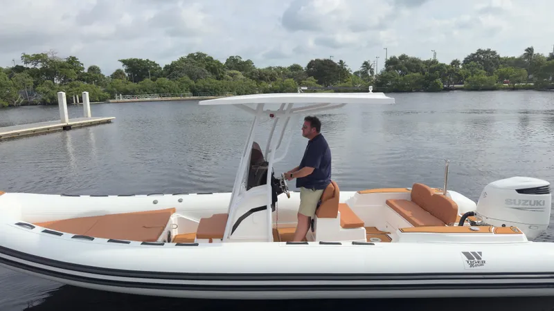 Slide: The Image of 2025 Tiger Marine 740 PL boat on water, featuring a sleek design and modern amenities. - 30