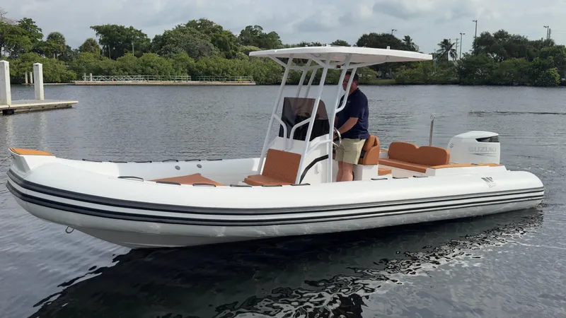 Slide: The Image of 2025 Tiger Marine 740 PL boat on calm water, featuring sleek design and modern amenities. - 31