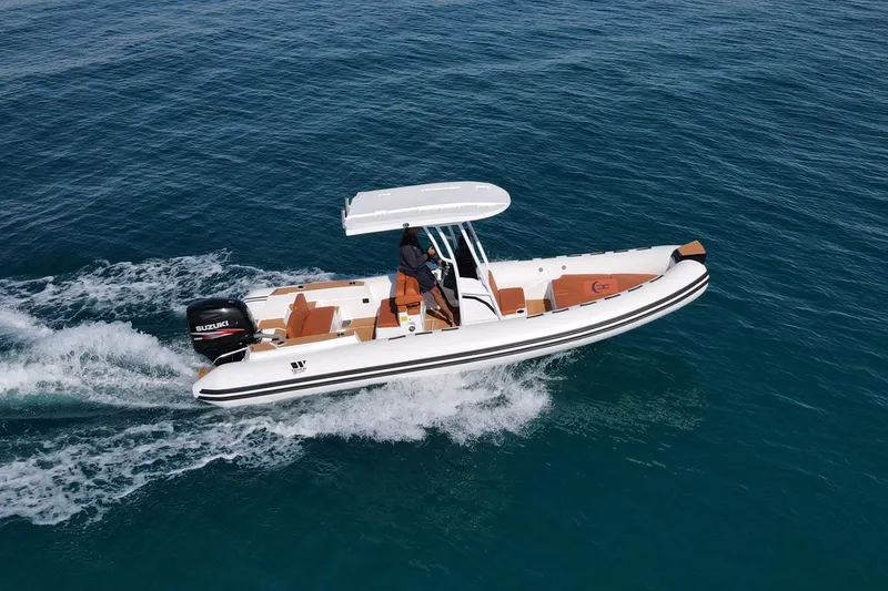 Slide: The Image of 2025 Tiger Marine 740 PL boat cruising on open water, featuring sleek design and powerful engine. - 5