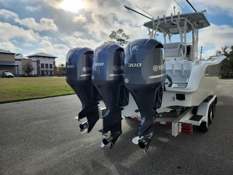 Slide: The Image of 2017 Yellowfin 34 Offshore boat with triple Yamaha 300 engines on a trailer. - 10
