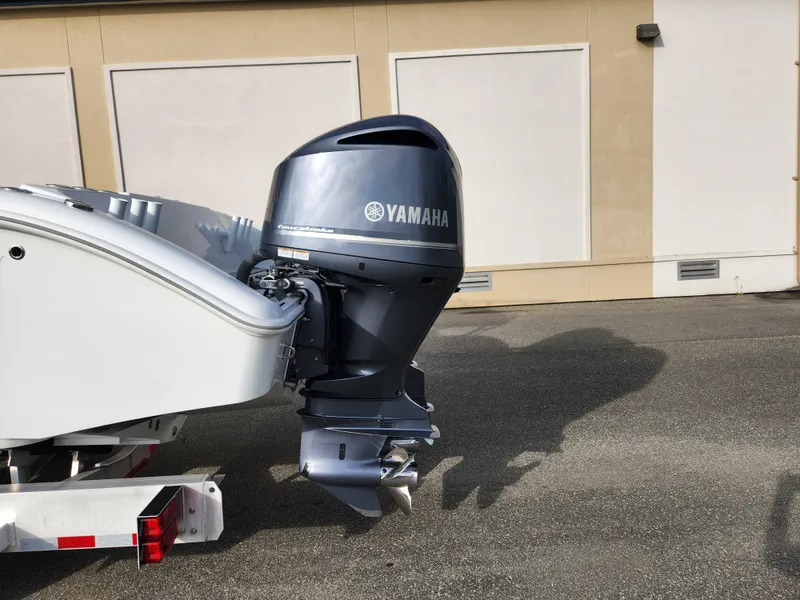 Slide: The Image of 2017 Yellowfin 34 Offshore boat with Yamaha outboard motor, parked on pavement. - 14