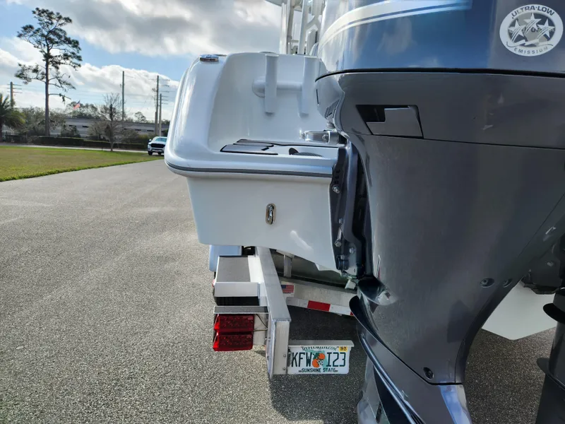 Slide: The Image of 2017 Yellowfin 34 Offshore boat on trailer, rear view with outboard motor. - 16