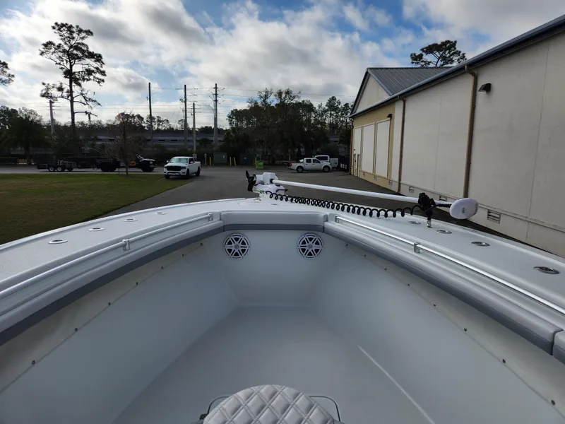 Slide: The Image of 2017 Yellowfin 34 Offshore boat bow with clear sky and trees in the background. - 18
