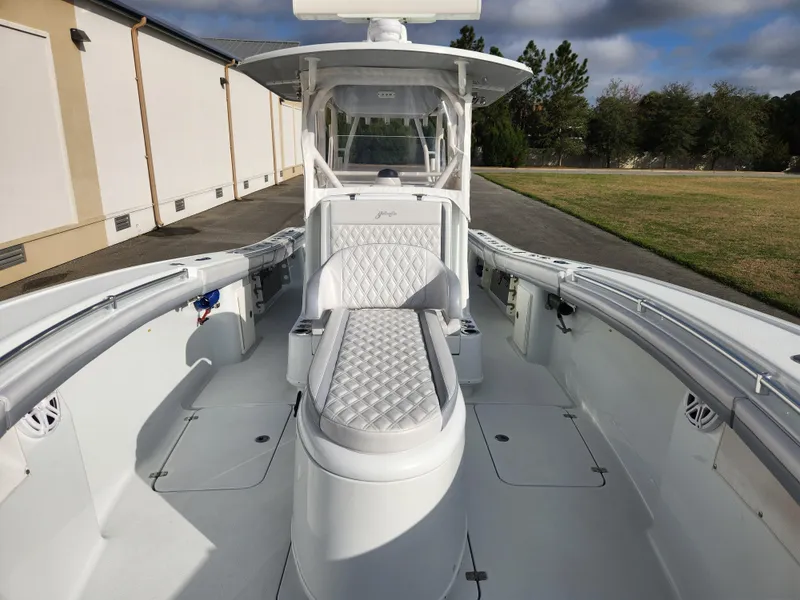 Slide: The Image of 2017 Yellowfin 34 Offshore boat with sleek white interior and cushioned seating. - 23