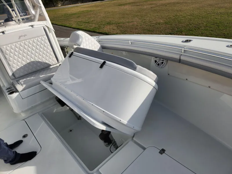 Slide: The Image of 2017 Yellowfin 34 Offshore boat interior with seating and storage compartments. - 29
