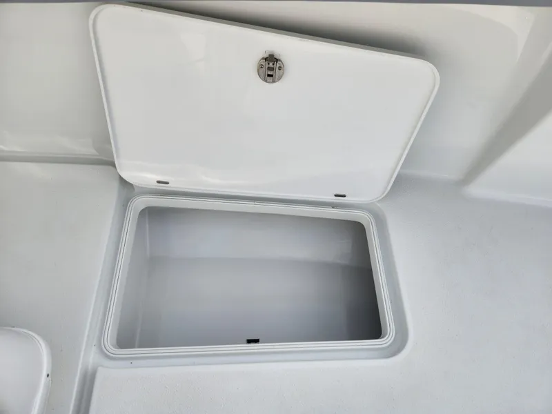 Slide: The Image of Open storage compartment on 2017 Yellowfin 34 Offshore boat. - 33