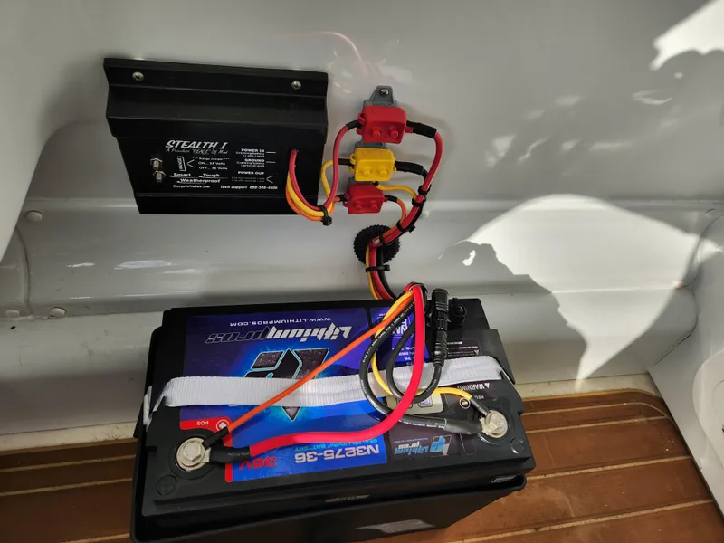 Slide: The Image of Battery setup in a 2017 Yellowfin 34 Offshore boat, featuring wiring and connections. - 41