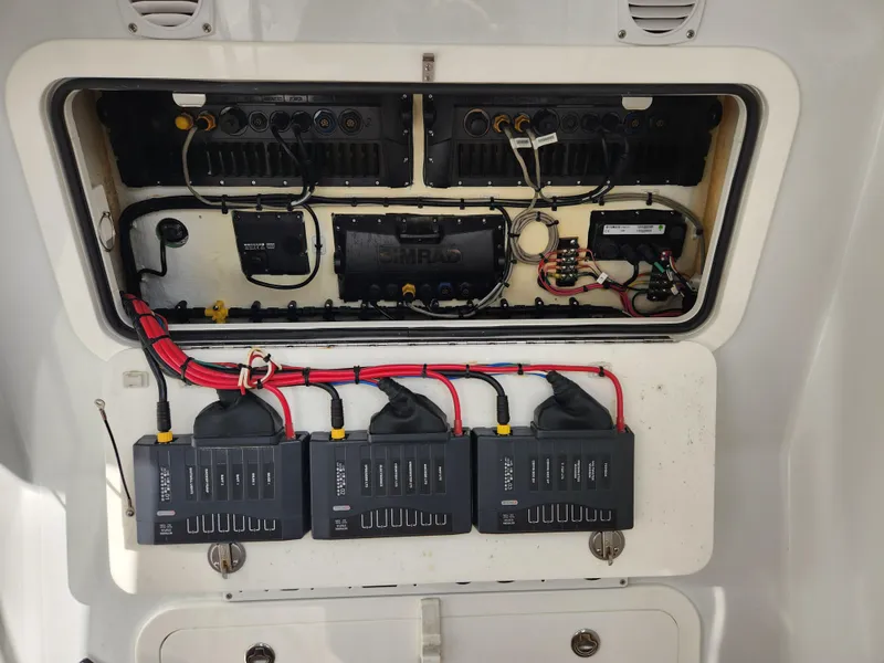 Slide: The Image of Electrical panel of a 2017 Yellowfin 34 Offshore boat, showcasing wiring and components. - 43