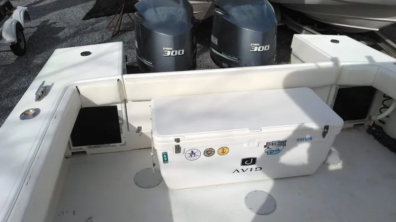 Slide: The Image of 1998 Ocean Master 31 CC boat deck with cooler and twin Yamaha 300 engines. - 7