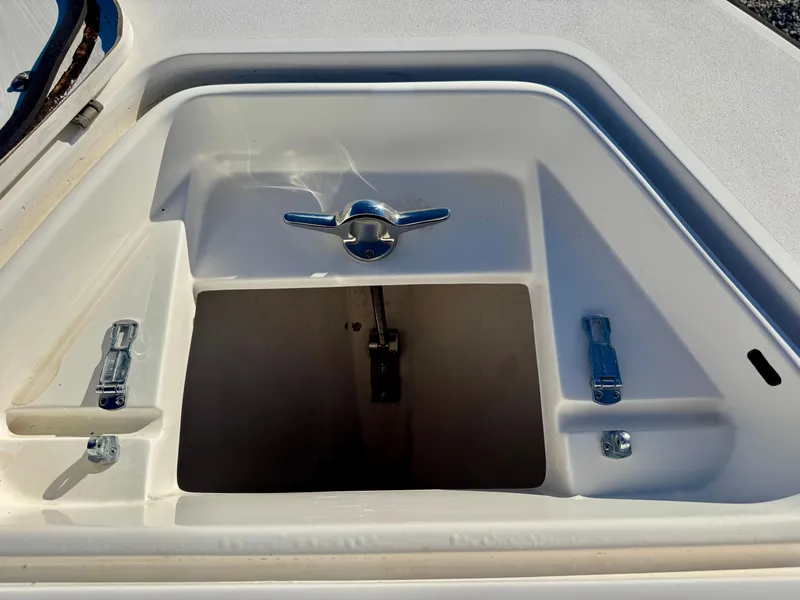 Slide: The Image of Contender 21 Open 2008 boat compartment with latch and hinges, open view. - 10
