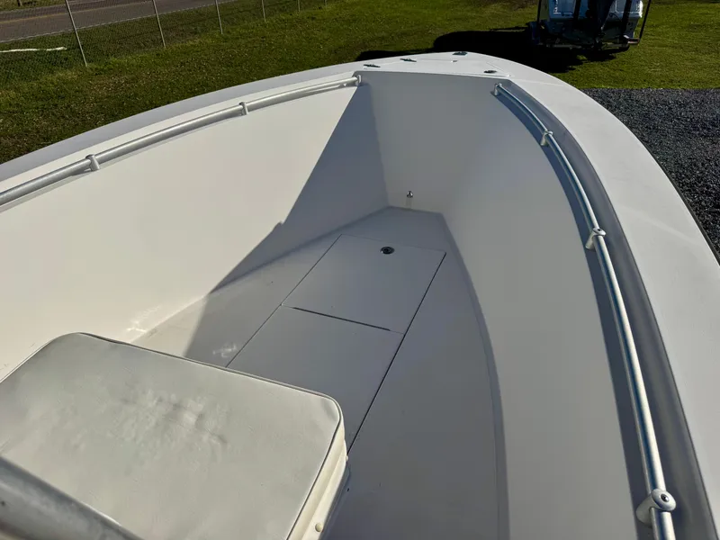 Slide: The Image of 2008 Contender 21 Open boat, white interior, spacious deck, sunny day. - 11