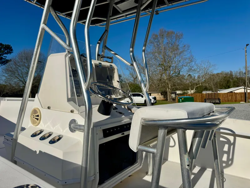 Slide: The Image of 2008 Contender 21 Open boat with T-top and console, parked outdoors. - 6