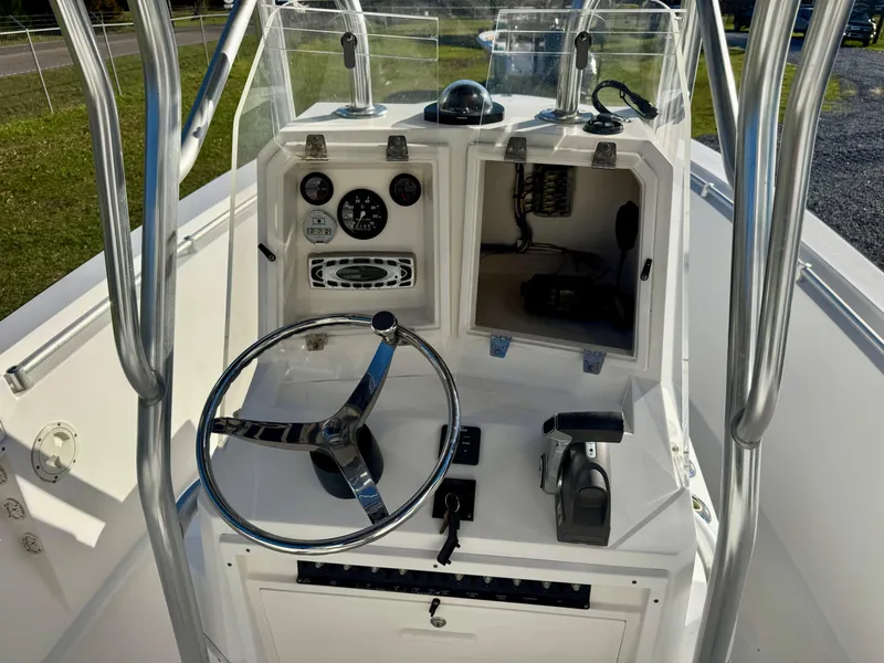 Slide: The Image of 2008 Contender 21 Open boat console with steering wheel and controls. - 8