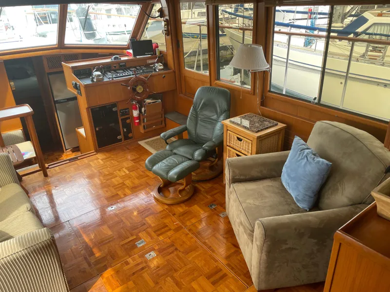 Slide: The Image of 1987 Lien Hwa 47' Mark III yacht interior with helm, seating, and wood flooring. - 20