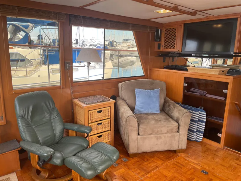 Slide: The Image of Interior of 1987 Lien Hwa 47' Mark III yacht with cozy seating and large window view. - 21