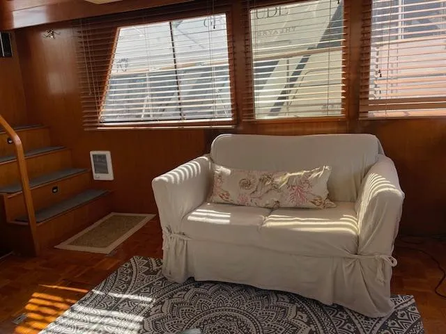 Slide: The Image of Cozy interior of 1987 Lien Hwa 47' Mark III yacht with sofa and wooden accents. - 23