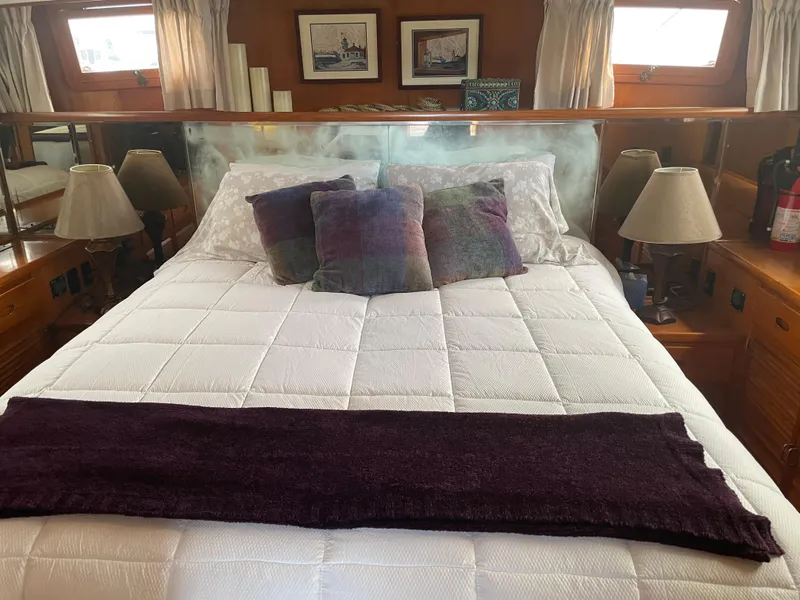 Slide: The Image of Cozy bedroom in 1987 Lien Hwa 47' Mark III Sundeck Yacht with plush bedding and decor. - 25